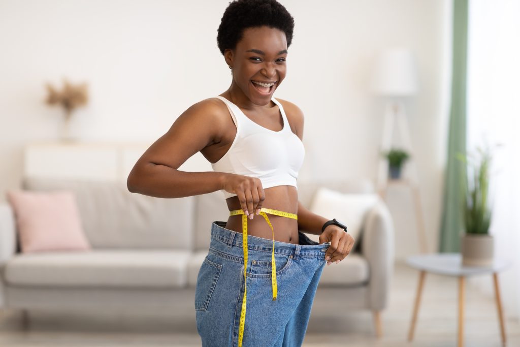 Successful,Weight,Loss.,Joyful,Young,Black,Lady,Measuring,Waist,Wearing