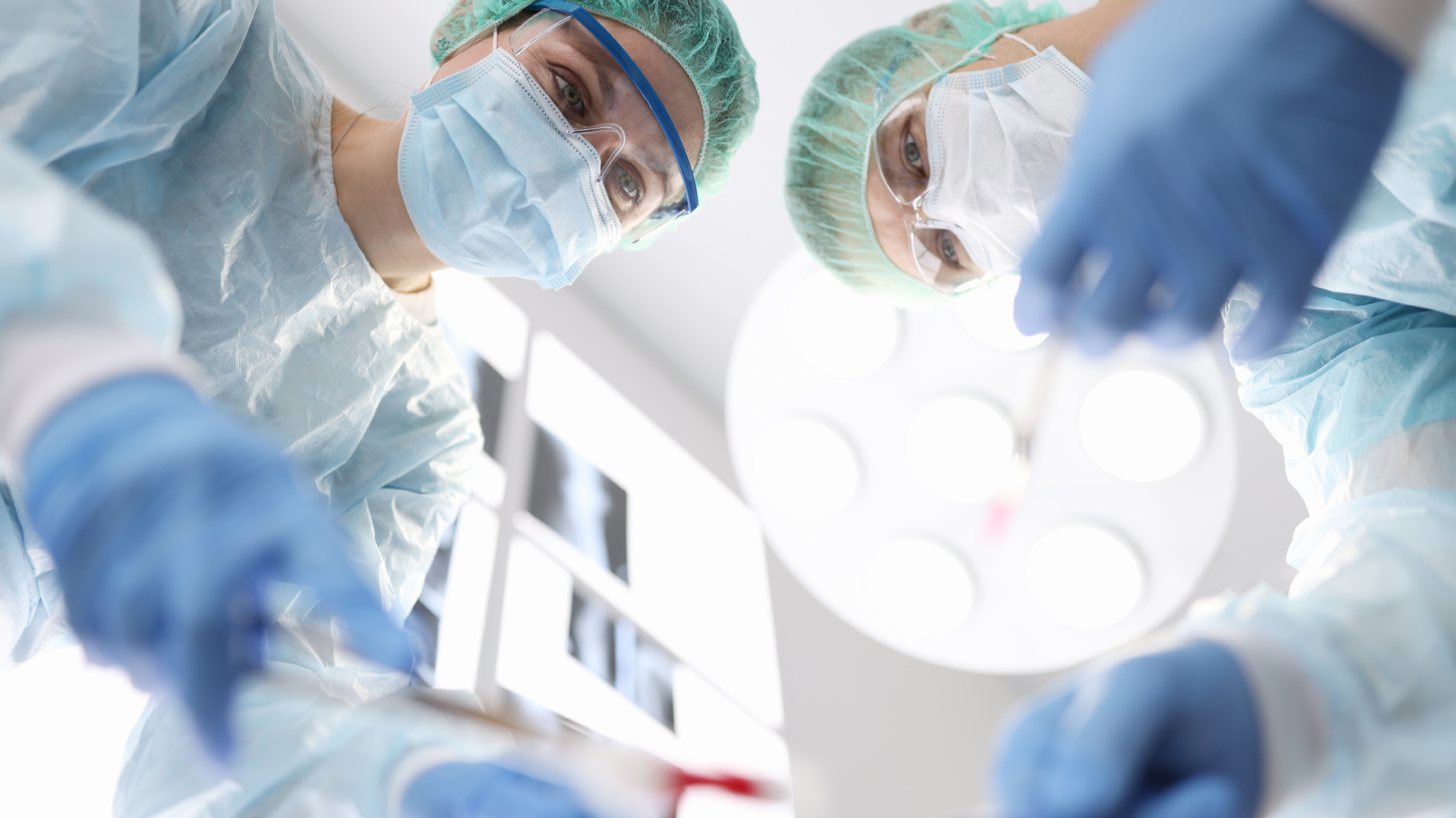 Surgeons preparing a patient for a plastic surgery after weight loss