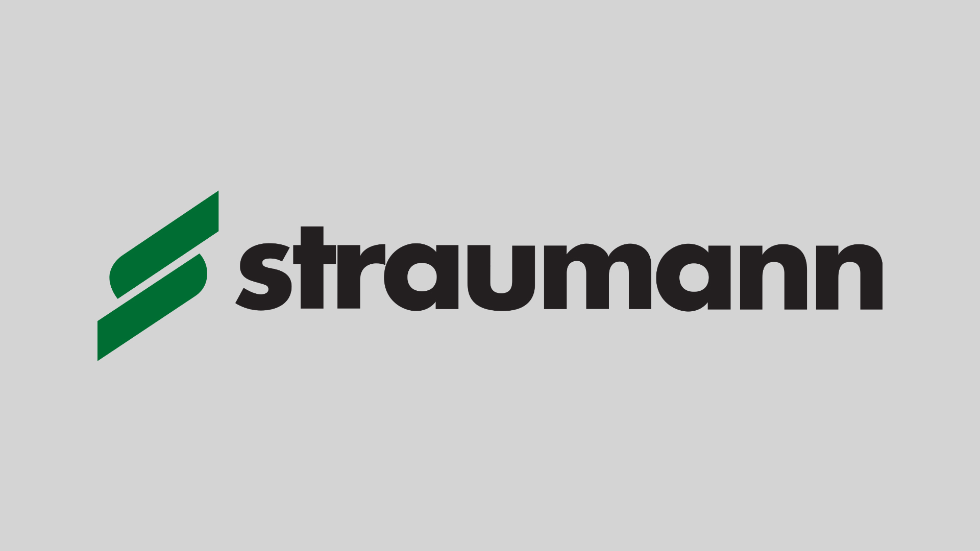 Le logo de la marque d'implants Straumann sur fond gris clair